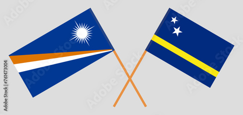Crossed flags of Marshall Islands and Country of Curacao. Official colors. Correct proportion