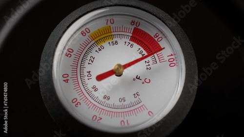 The thermometer in the teapot shows the temperature of boiled water. Manometer or thermometer gauge under high steam pressure or temperature © Евгений Логвиненко