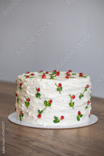 White homemade cake on a wooden table