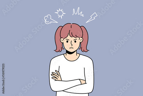 Angry little girl stands with arms crossed and looks at screen with hatred, showing disobedience or resentment. Teenage child needs parental affection to get rid of hatred and negative emotions