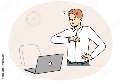 Furious businessman look at wristwatch unhappy with employee being late for work. Mad employee stand near empty desk frustrated with worker late in office. Vector illustration.