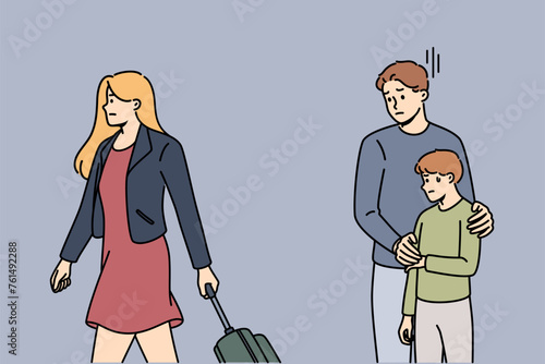 Divorce of parents traumatizes child, experiences stress because of mother with suitcase leaving family. Divorce between man and woman causes frustration and depression in pre-teen boy