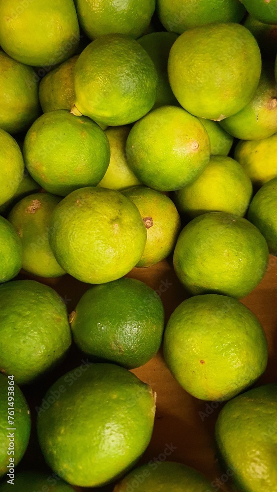 Close up pile of tasty fresh limes sold at the market as a background.	