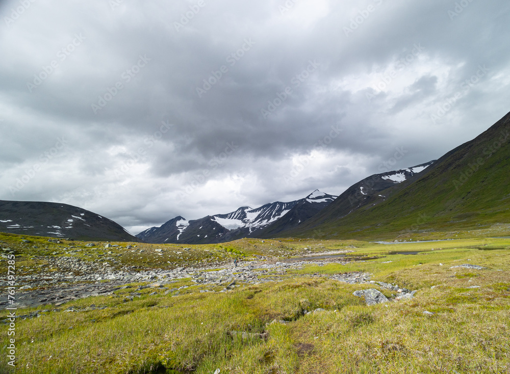 A beautiful summer landscape with mountains of Sarek National Park, Sweden. Wild scenery of Northern Europe. A beautiful summer landscape with mountains of Sarek National Park, Sweden. Wild scenery of Northern Europe.