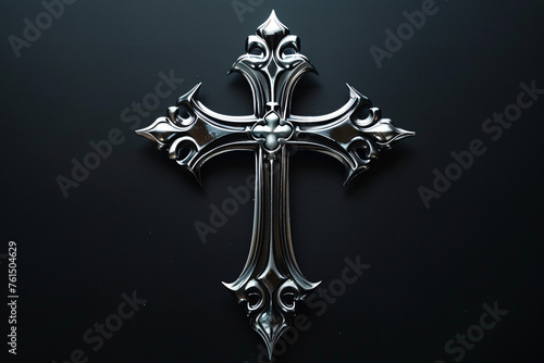 Metallic ornate cross on a dark background
