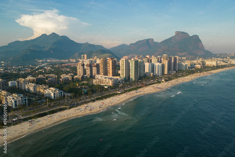 Fototapeta premium Aerial View of Barra da Tijuca Beach With Condos and Mountains in the Horizon in Rio de Janeiro, Brazil
