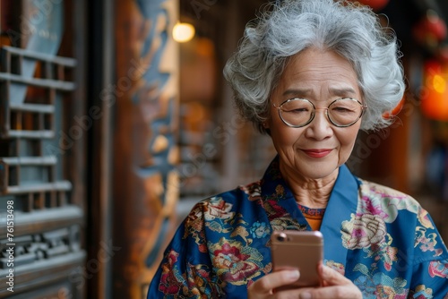 Woman Wearing Glasses Looking at Cell Phone