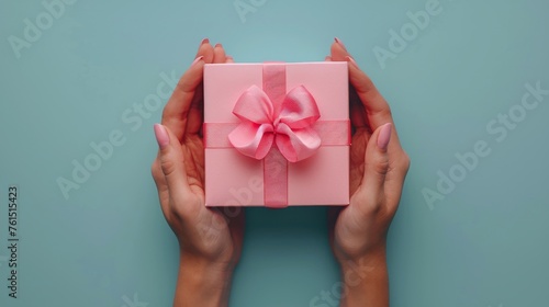 Person Holding Pink Gift Box With Pink Bow
