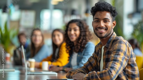 A diverse group of professionals gathered around a table, engaged in a brainstorming session, sharing ideas, collaborating on projects, and working together towards a common goal, showcasing teamwork