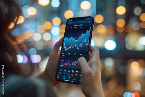 Stock trading investor, trader or broker using crypto exchange platform app on smartphone analysing exchange market chart investing money in financial market on mobile screen with cell phone in hands. photo