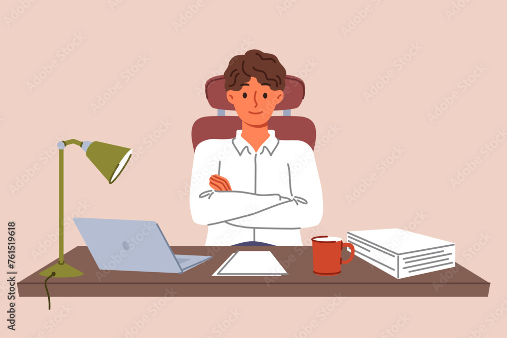 Successful man entrepreneur sits at desk with papers and laptop, crossing arms as sign of self-confidence. Young guy entrepreneur building business in legal or accounting industry. Successful man entrepreneur sits at desk with papers and laptop, crossing arms as sign of self-confidence. Young guy entrepreneur building business in legal or accounting industry.