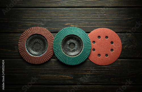 A set of round carpentry tools for polishing and cleaning boards or whetstones. Abrasive tools on black boards photo