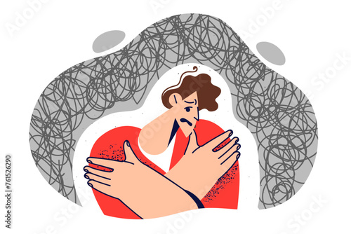 Man with severe psychological trauma experiences panic attack, hugs himself, hiding from troubles