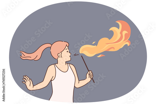 Woman blow fire with mouth