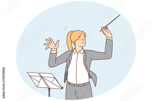 Female conductor leading orchestra