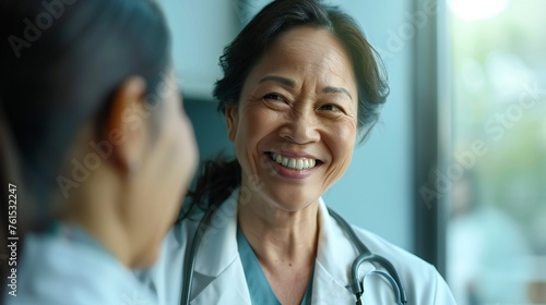 Female doctor smiling during virtual appointment with patient.