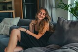 Smiling girl enjoying day off lying on the couch, home concept, Relaxing woman