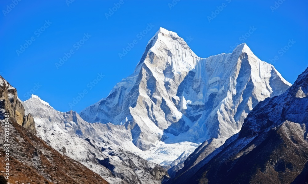 the rugged beauty of snow-capped peaks piercing the clear blue sky 
