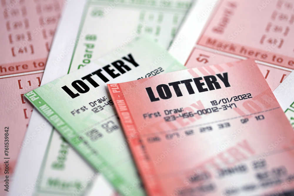 Green and red lottery tickets on blank bills with numbers for playing lottery close up Green and red lottery tickets on blank bills with numbers for playing lottery close up