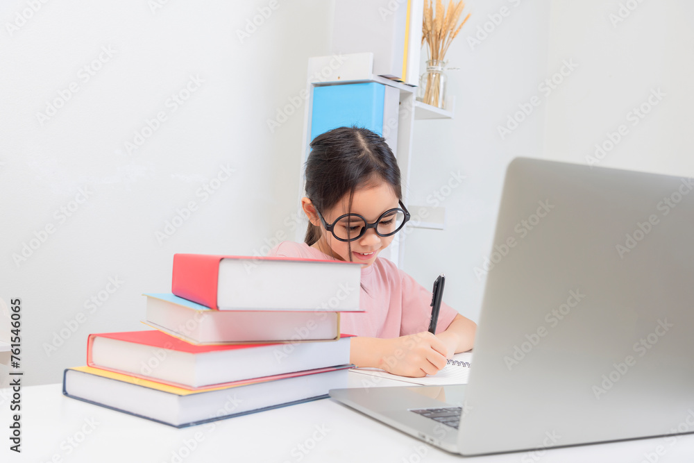 Cute little Girl asia Study At Home With Laptop And Wireless Headphones Cute little Girl asia Study At Home With Laptop And Wireless Headphones