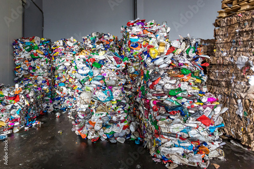plastic pressed bales at the modern waste hazardous processing plant. Separate garbage collection. Recycling and storage of waste for further disposal. Business for sorting and processing of waste.