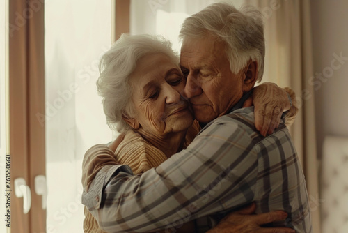 Portrait of loving senior husband and wife hugging and bonding with true emotions