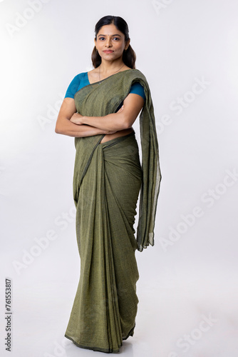 Photography Portrait of a confident woman of Indian origin wearing traditional dress sari