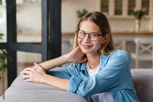 Young beautiful caucasian woman student tutor teacher businesswoman relaxing at home in glasses. Stay at home concept photo
