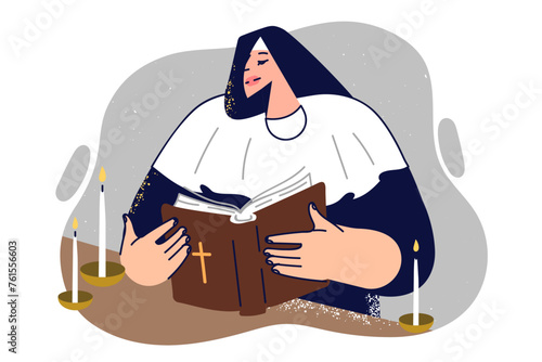 Woman nun reads bible standing near altar with burning candles during sunday liturgy