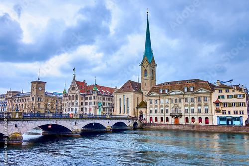 Munsterbrucke bridge that spans the Limmat River and stunning Fraumunster church, Zurich, Switzerland photo