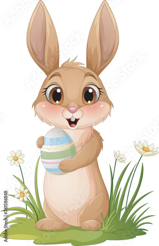 Cartoon little bunny holding Easter egg © tigatelu