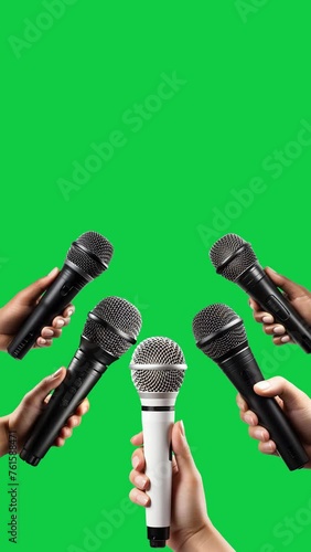 hands holding mic with interview set vertical video template on green screen background