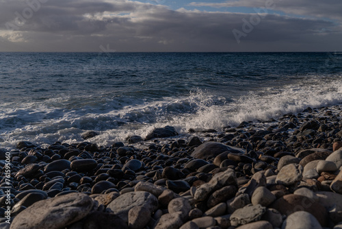 Beautiful seascape with pebble beach and sea waves of Madeira, Portugal