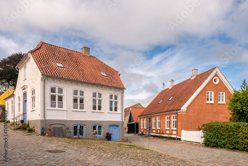 Streetscene of cobbled streets with historic houses in old town of Mariager, Nordjylland, Denmark