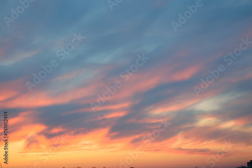 Obraz na płótnie Stunningly beautiful multi-colored violet-pink-lilac evening sky with the yellow light of the setting sun, multi-colored clouds spreading from the lower horizon w salonie