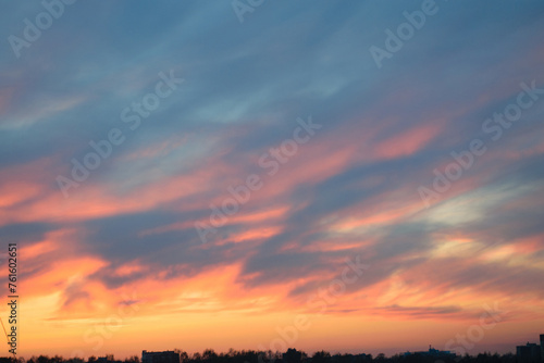 Obraz na płótnie Gray-blue gloomy dull sky at sunset, evening twilight, silhouette of the city on the horizon w salonie