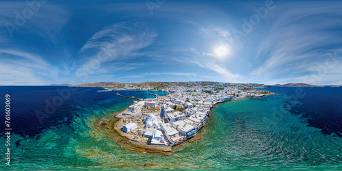 Amazing aerial view of Panagia Paraportiani church in Mykonos town from the sea on a sunny summer day