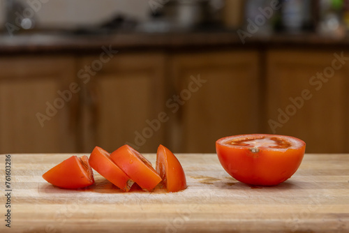 sliced tomato on a chopping board