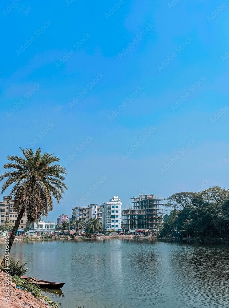 Obraz premium Harmonious Natural Tranquility Palm Trees, Nature, and Pondside Boating