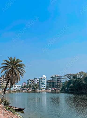 Harmonious Natural Tranquility Palm Trees, Nature, and Pondside Boating © MD NAZMUL