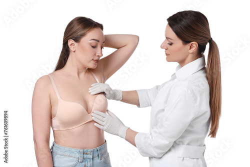 Mammologist checking woman's breast on white background
