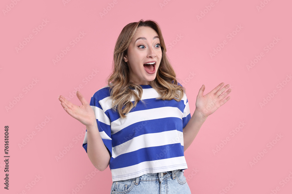 Portrait of happy surprised woman on pink background Portrait of happy surprised woman on pink background