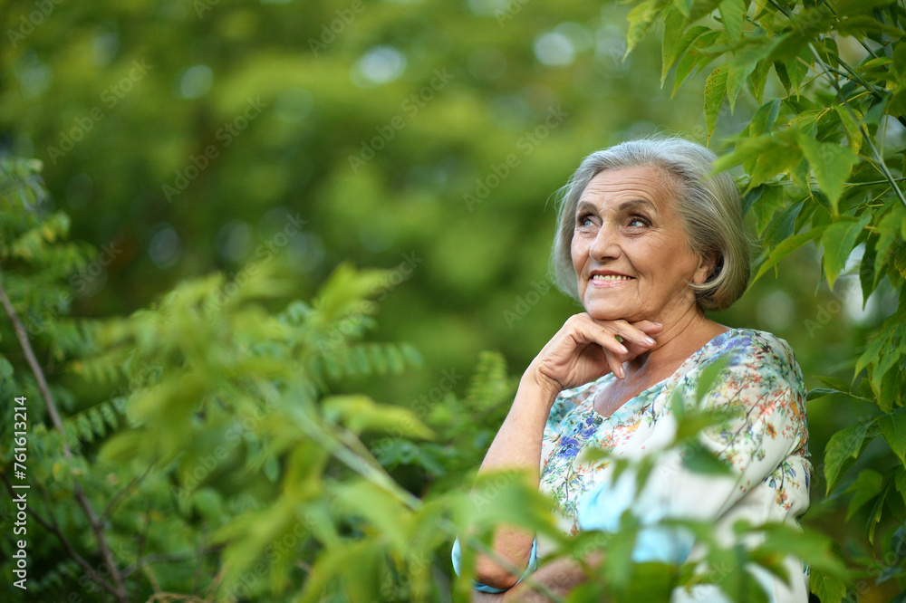 Portrait of senior woman in summer park Portrait of senior woman in summer park