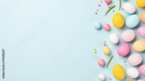 A blue background with a bunch of colorful eggs scattered around it. The eggs are of different colors and sizes, and they are placed in various positions. Scene is cheerful and playful