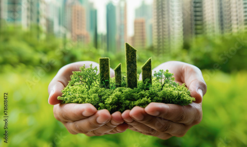 Hands cradling a green miniature cityscape, symbolizing urban sustainability and green living. The harmonious balance of urban development and environmental stewardship.