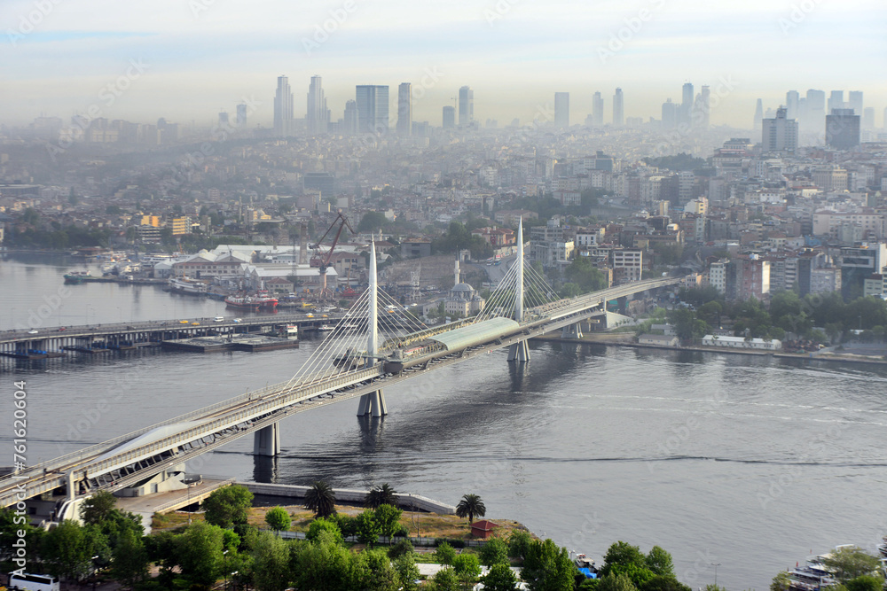Obraz premium Istanbul metro bridge and the city skyline in the background. Golden Horn, Istanbul, Turkey.