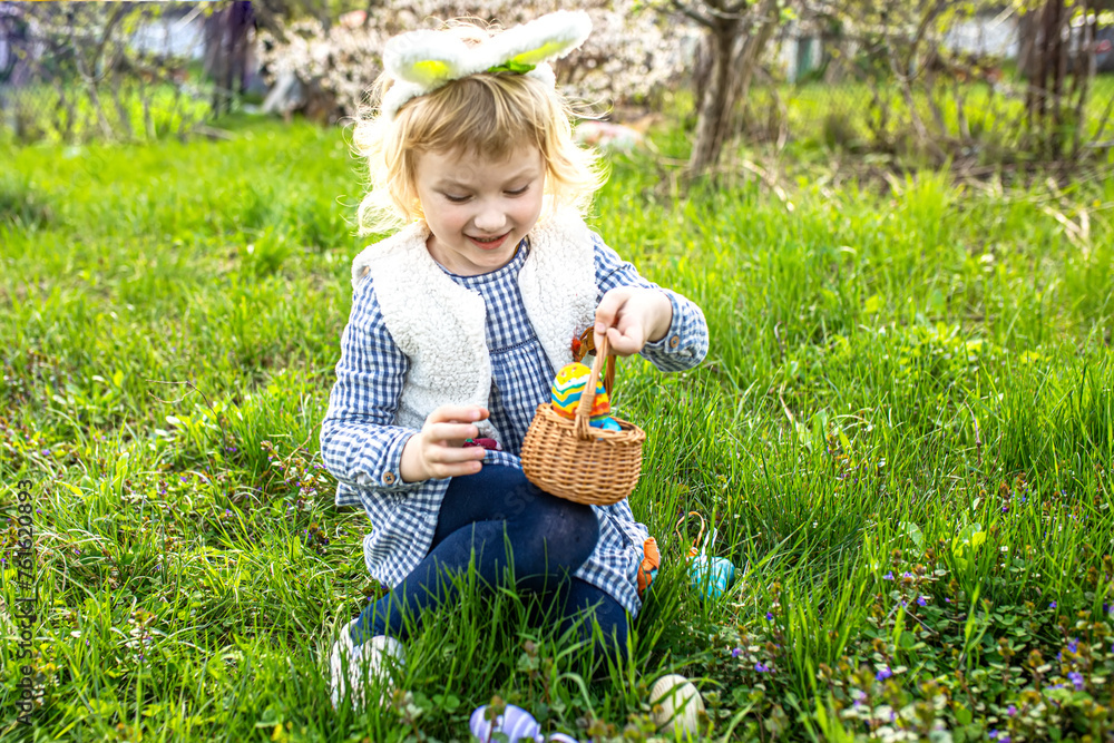 Playful Easter traditions. happy child engages in an egg hunt, filling basket with symbols of spring and renewal. Playful Easter traditions. happy child engages in an egg hunt, filling basket with symbols of spring and renewal.