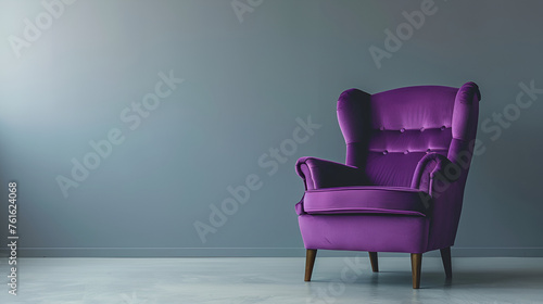 purple armchair on the grey background © Daria