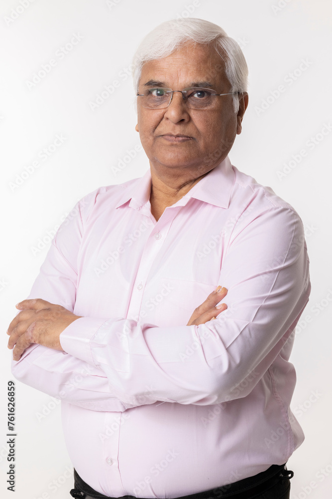 Portrait of smiling senior man with arms crossed at white background
Portrait of smiling senior man with arms crossed at white background