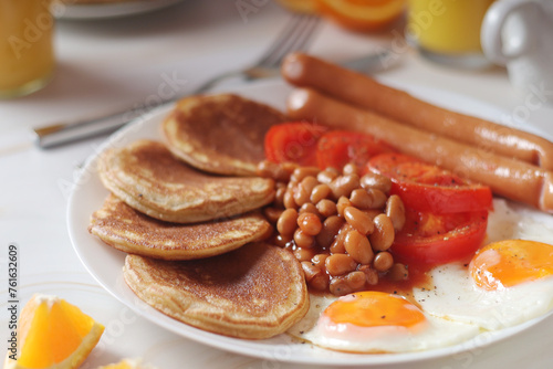 Traditional British breakfast with sausages and beans 